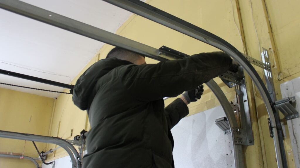 garage door technician installing a new garage door